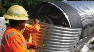 Crews working on a stormwater pipe that'll be installed in the ground.