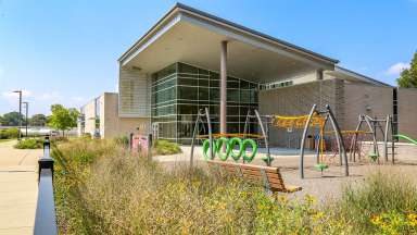 The outside of the Halifax Park community center and part of the playground