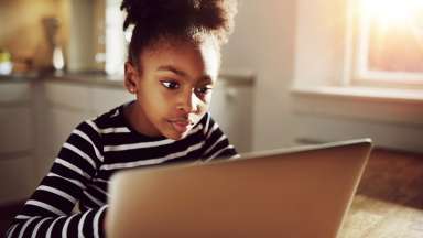 Girl sitting at laptop