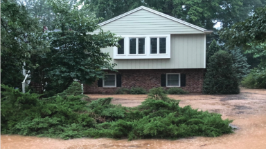 Floodwater near a home during a storm