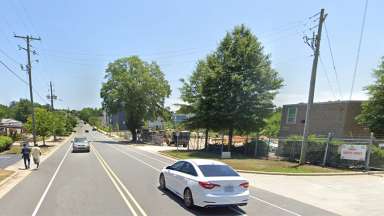 Maywood Avenue showing people have to walk in street due to no sidewalk.