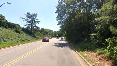 A view of Wade Avenue right after Oberlin Road Bridge, looking downtown, images shows need for sidewalk.