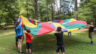 Kids playing with parachute