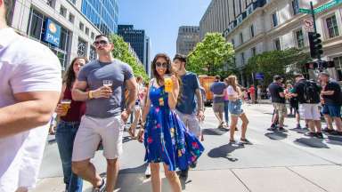 event attendees drink beverages in downtown raleigh