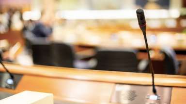 stock photo of a microphone at a podium