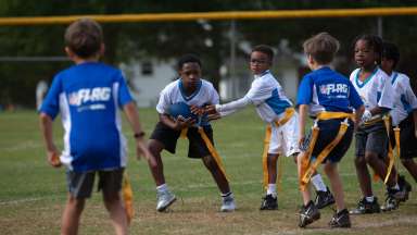 children playing flag football