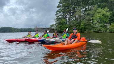 teen summer campers kayaking