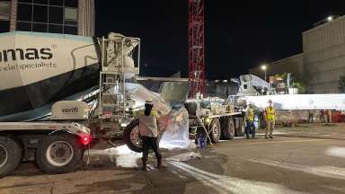 Concrete trucks preparing to pour concrete at Raleigh City Hall site