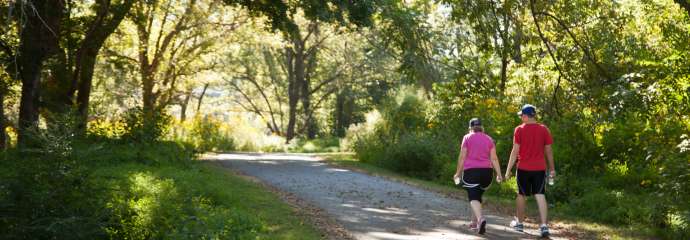 Two people walking on the greenway