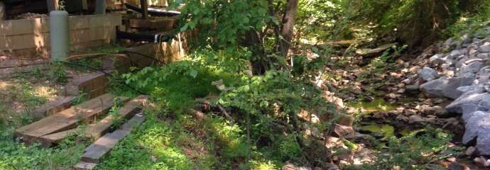 An eroded stream that's very close to a home on Kayla Court