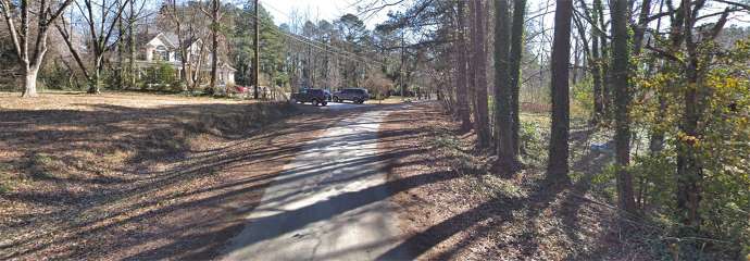 Aberdeen Drive, showing the roadway is not paved and lack of sidewalk.