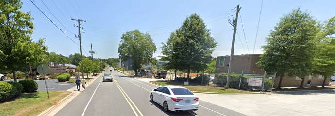 Maywood Avenue showing people have to walk in street due to no sidewalk.