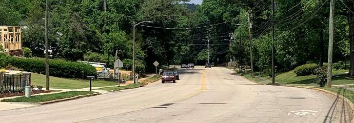 Lake Boone Trail Between the I-440 ramps and Ridge Road, showing road in current condition