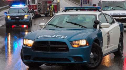 Raleigh Police Vehicle in roadway blocking traffic for an accident