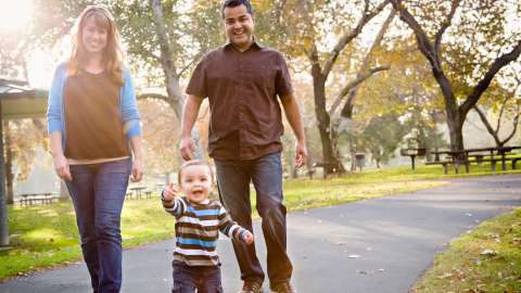 View of family walking happy in the park