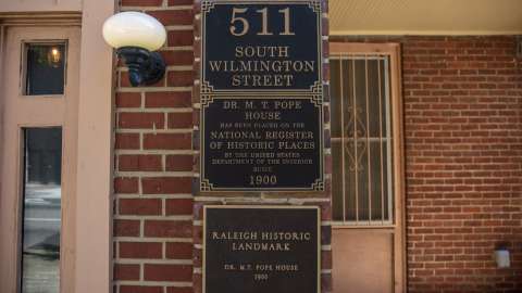 A shot of the landmark and address placards outside the Pope House