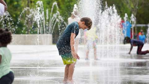 Kid in water feature splashing around