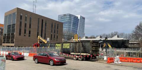 image shows a recycling truck for steel at construction site