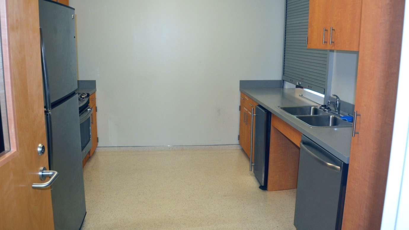 Fridge, microwave, oven and dishwasher inside the Abbott Creek Community Center Kitchen