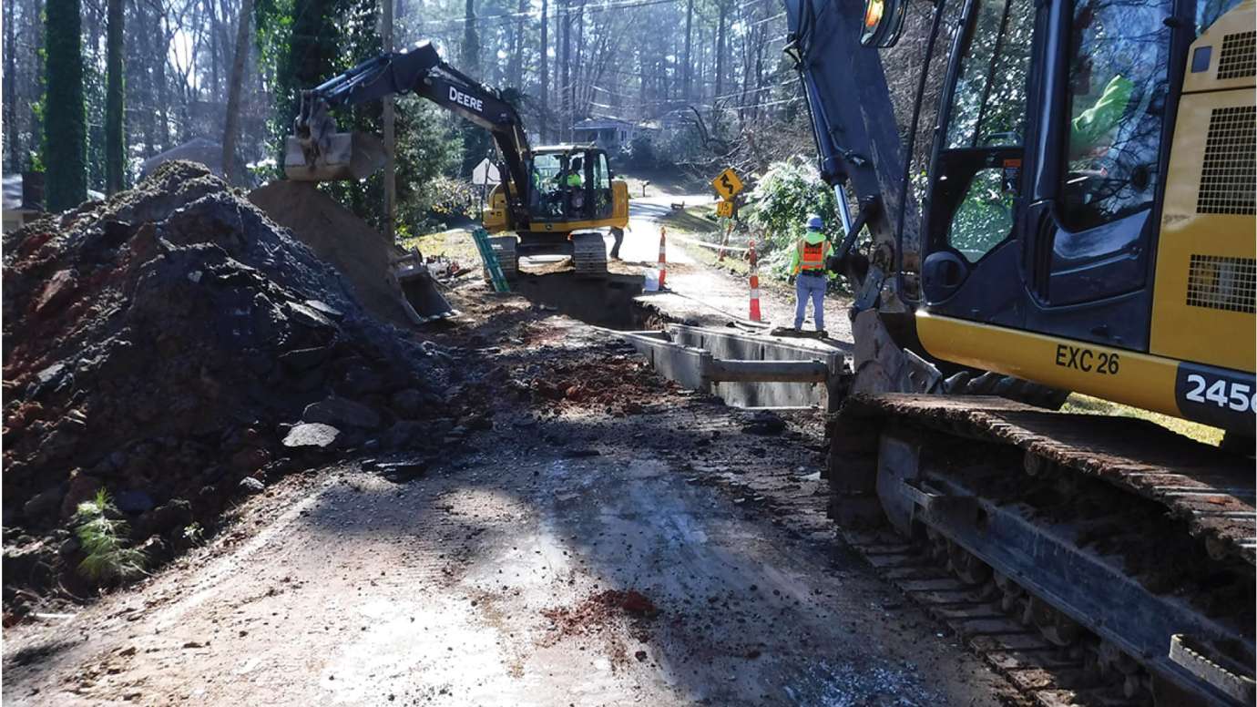 Construction crews digging on Swift Drive