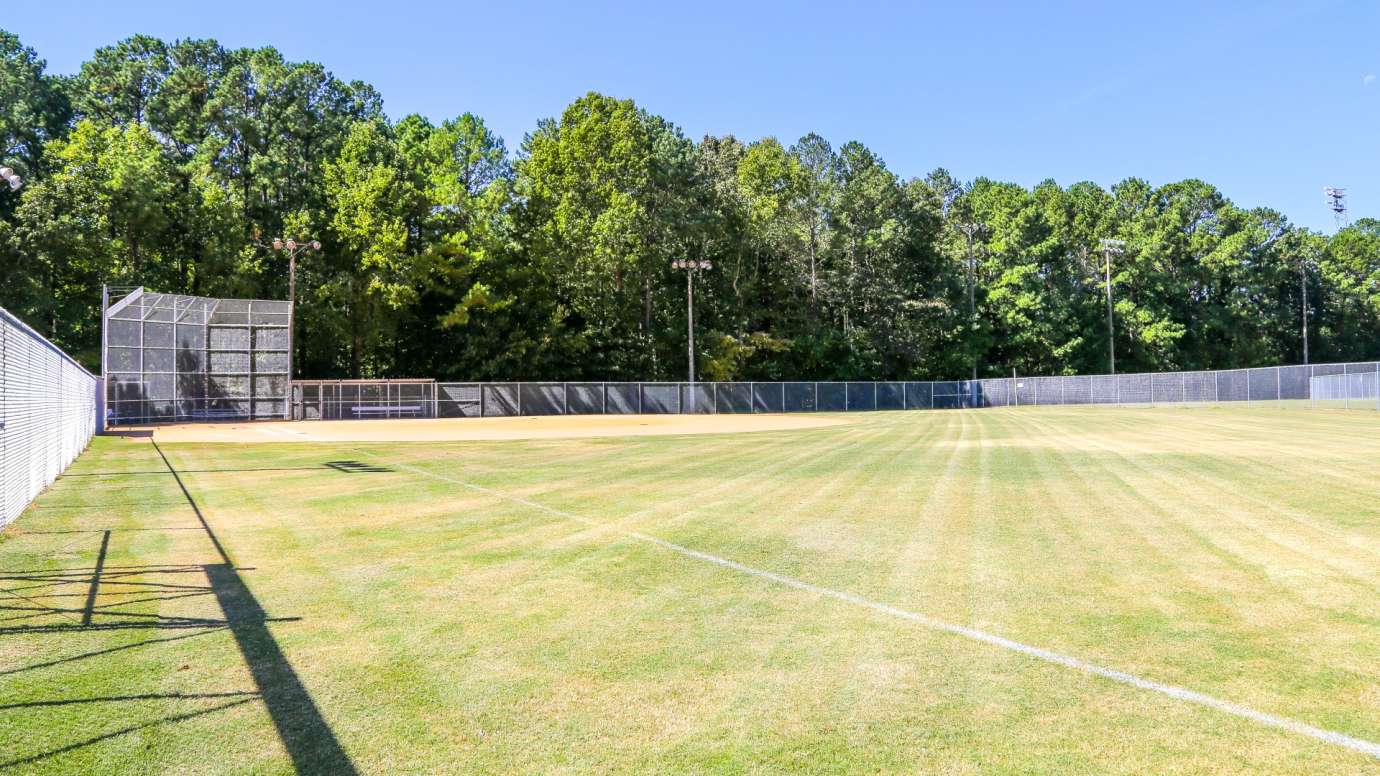 One of three large, open baseball fields at Optimist Park 