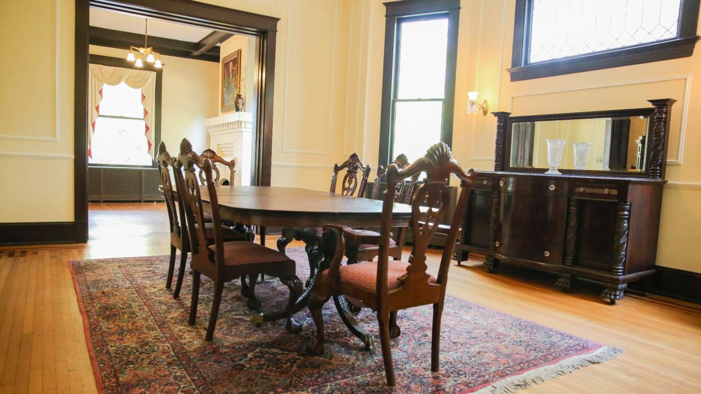 An interior room with a table and chairs 