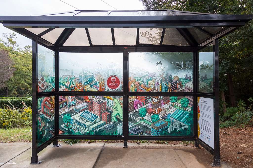 artwork by Ian Wenstrand covering the windows of a bus shelter