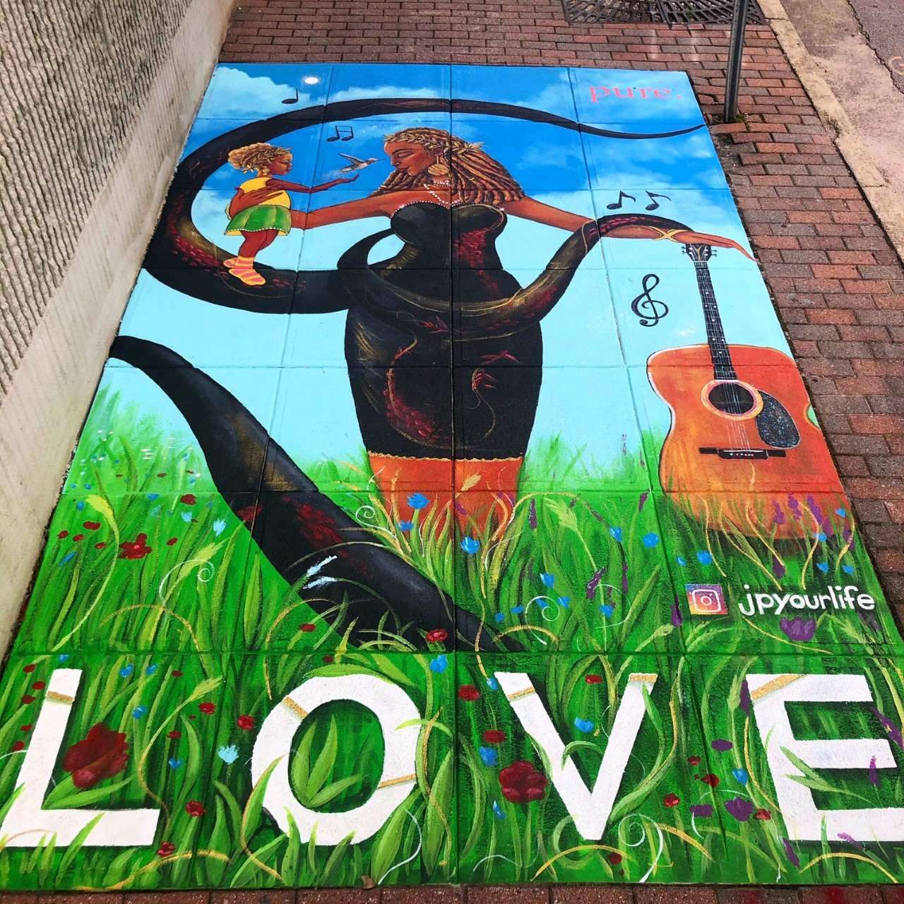 Sidewalk mural by artist JP Jermaine Powell