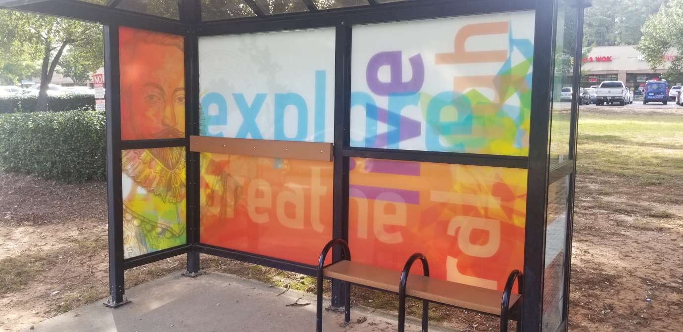 artwork by Sergio Analco covering the windows of a bus shelter