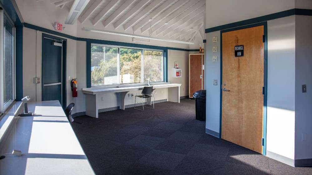 Inside of control tower referee lounge with seats and benches