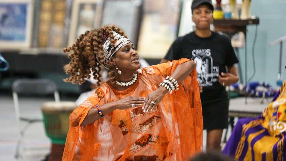 Woman in bright dress dancing