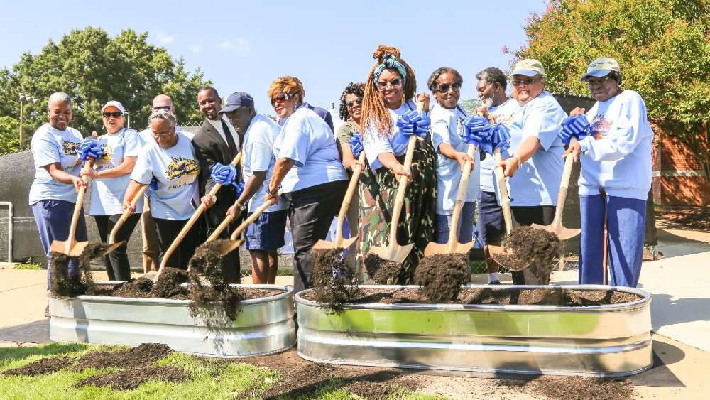 Community members break ground on the new community center.