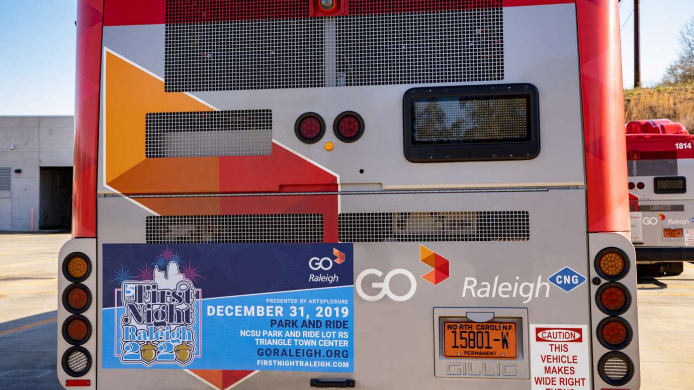 Back of GoRaleigh bus with an ad for First Night - New Year Event