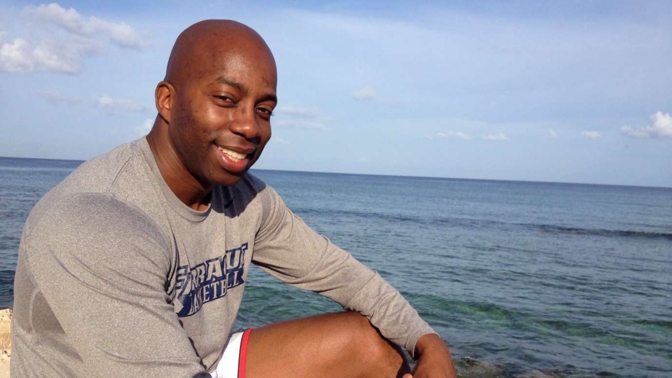 Man smiling on coast of beach