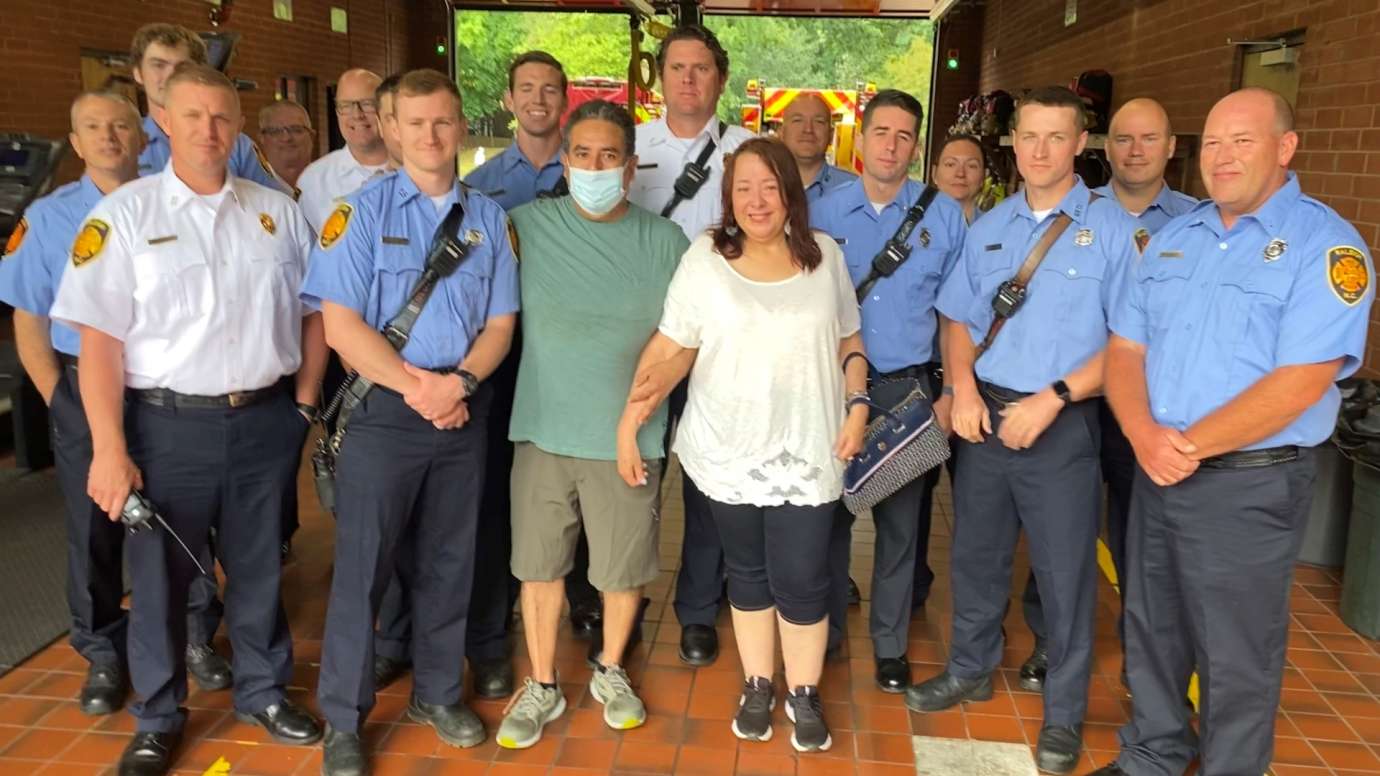 Rescued family meets firefighters at fire station