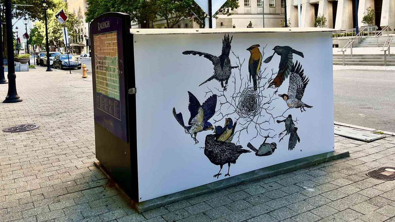 Artwork on a news kiosk on Fayetteville Street by Leslie Bartlebaugh