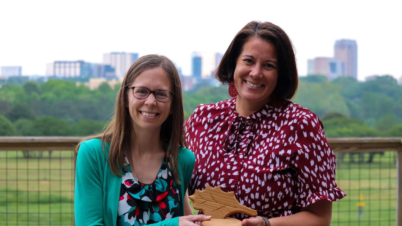 Two members of NCSU Make-a-thon team pose with award