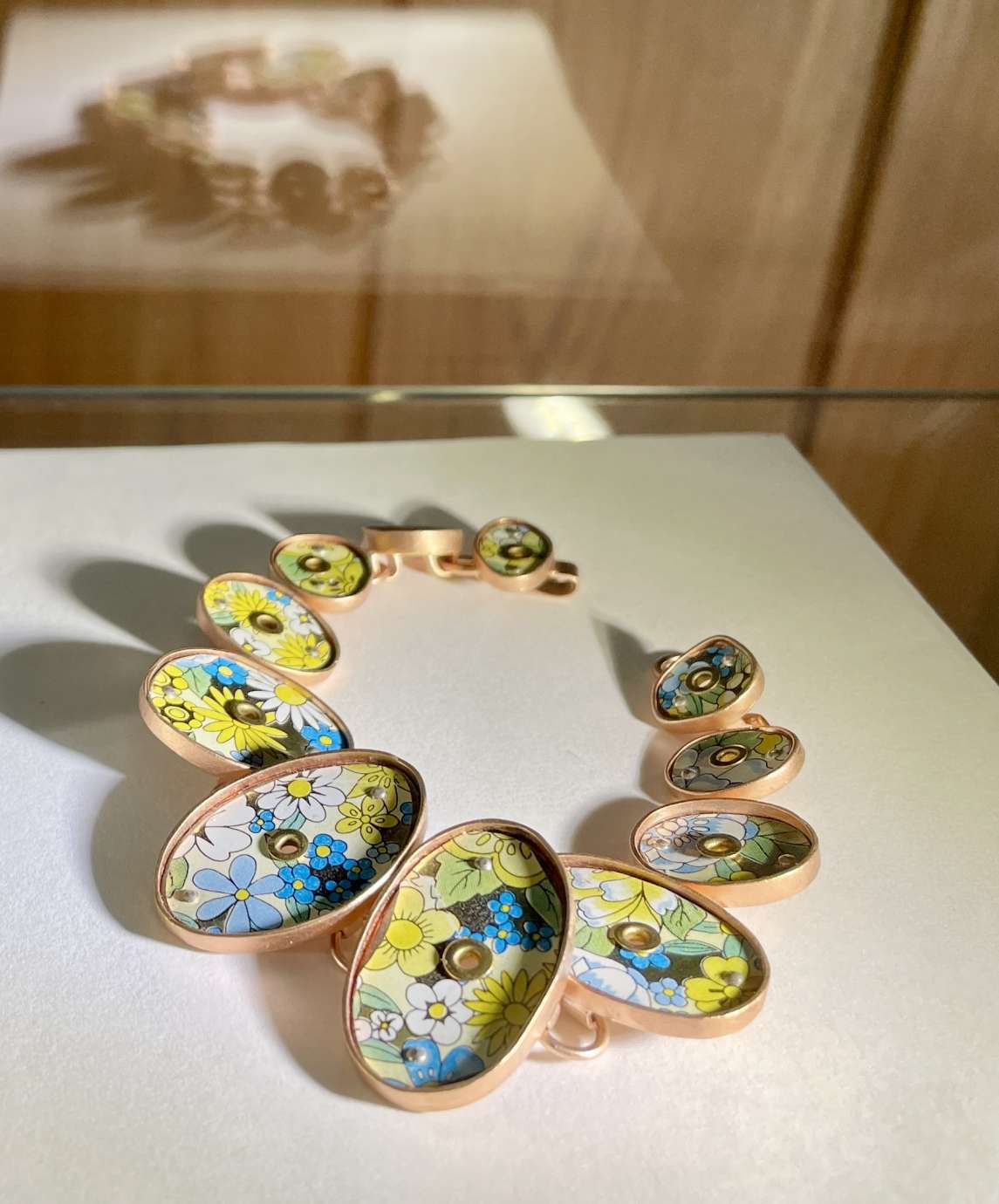 necklace with a series of ovals with colored inlay