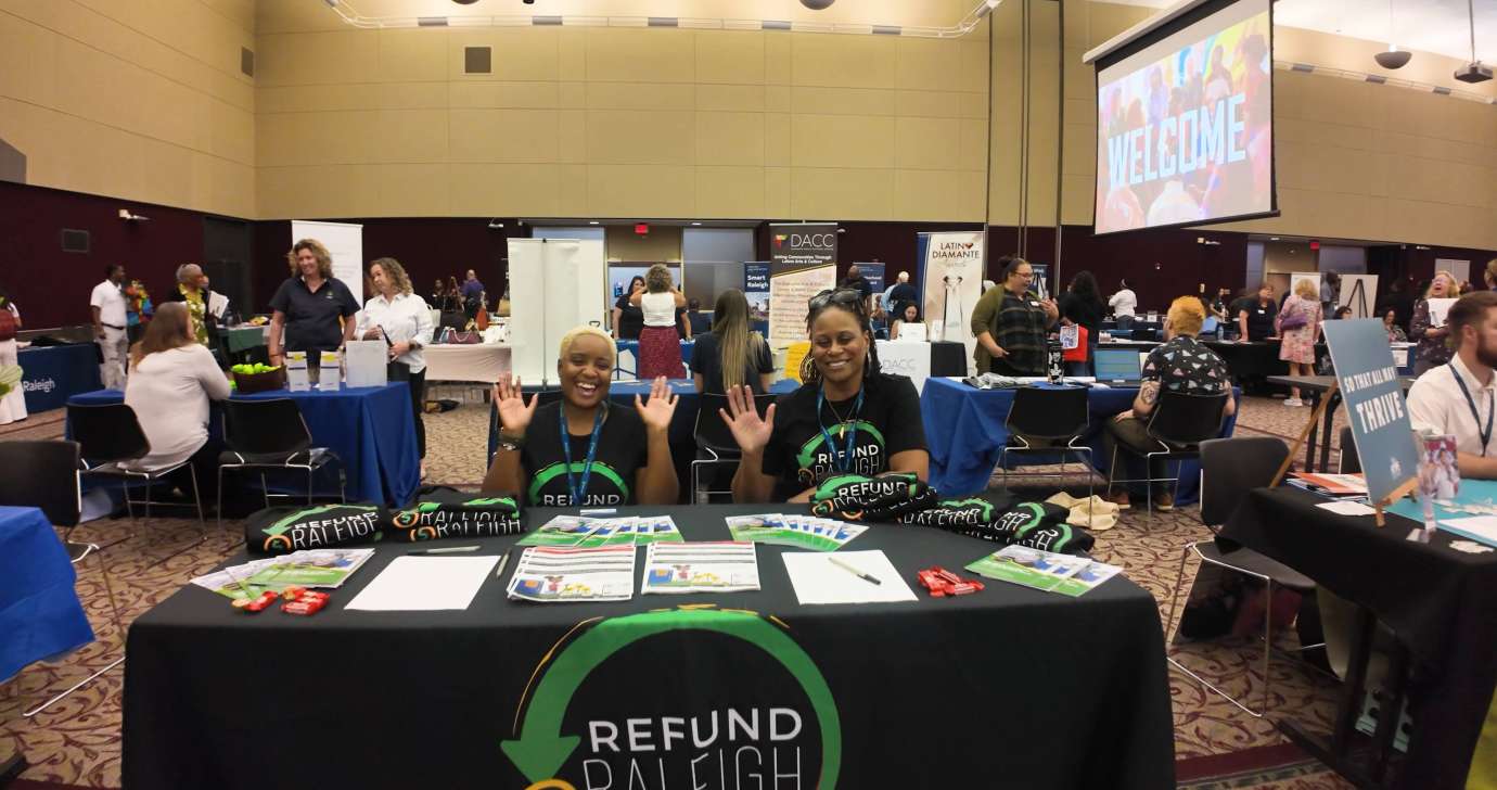 Refund Raleigh staff members host a table in the expo hall