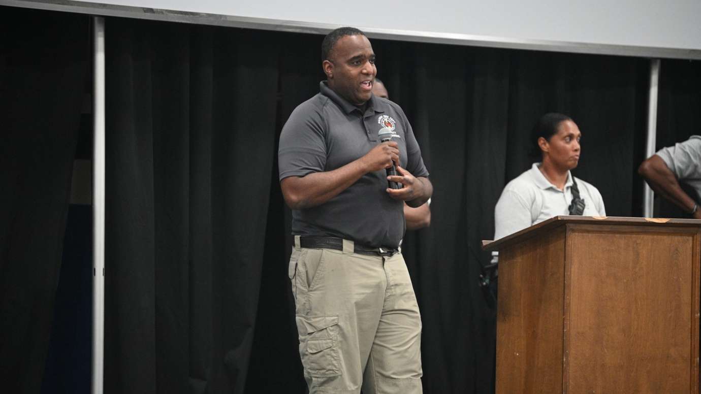 Raleigh Fire Department Lieutenant Lemuel Hubbard speaks to campers about the fire department and serving the community.