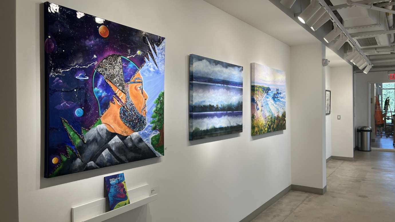 Gallery wall with colorful paintings