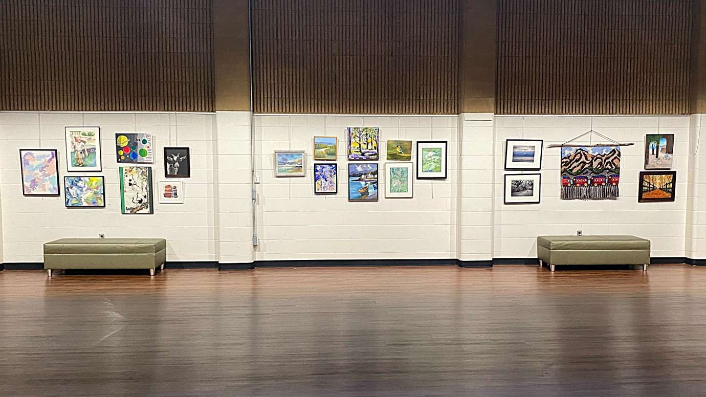 Gallery with framed artwork on the wall. 