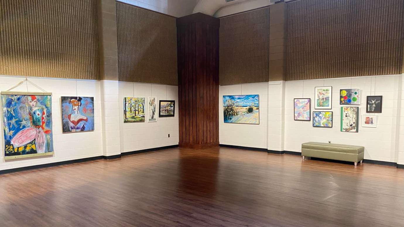 Gallery with framed artwork on the wall. 