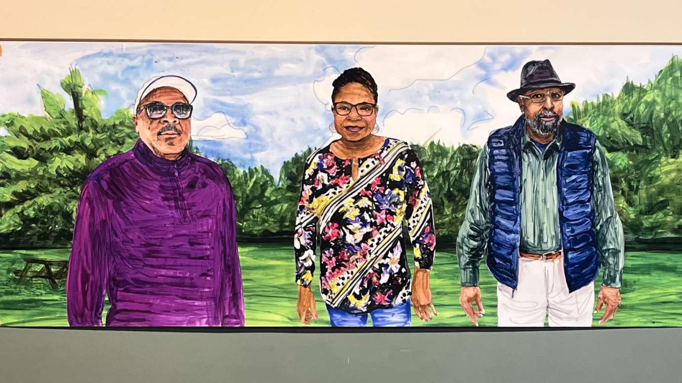 a painting of Barwell Road community members smiling