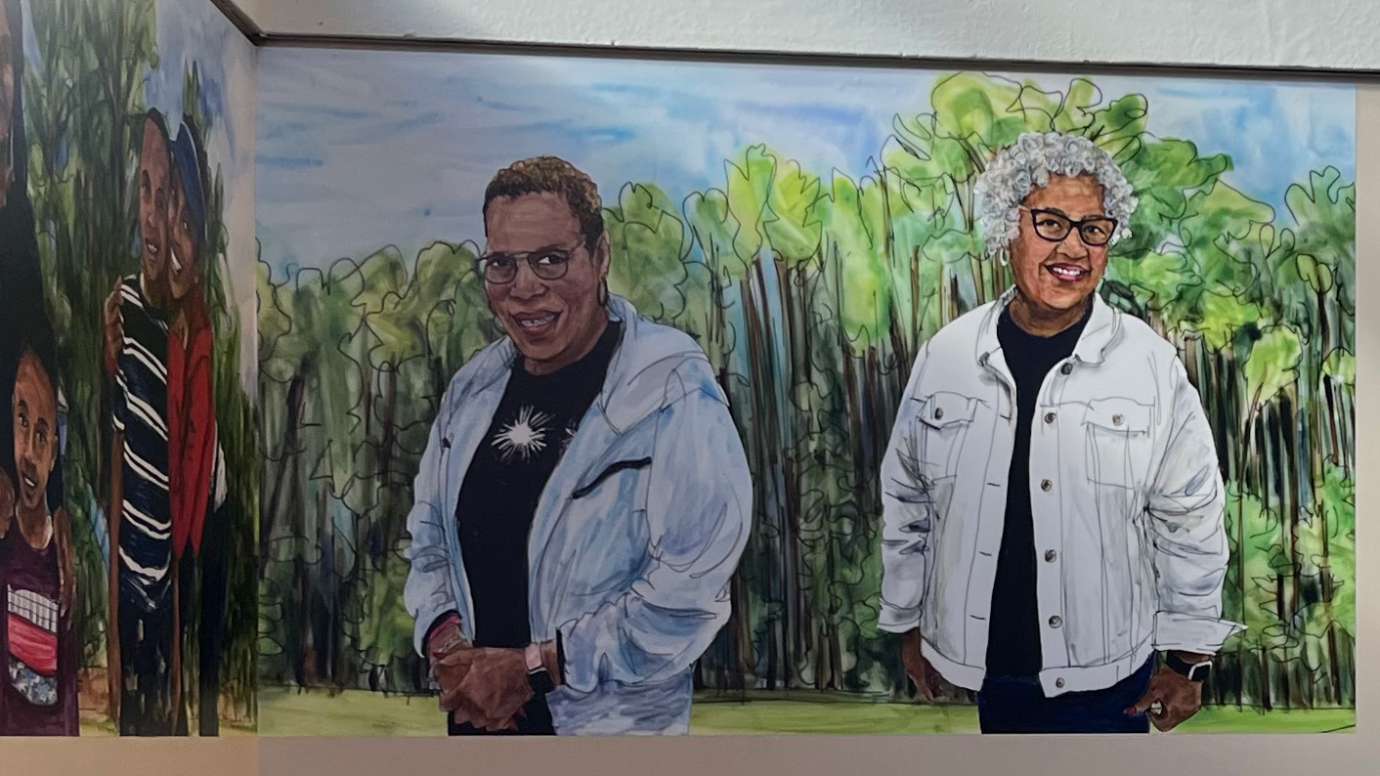 a painting of Barwell Road community members smiling