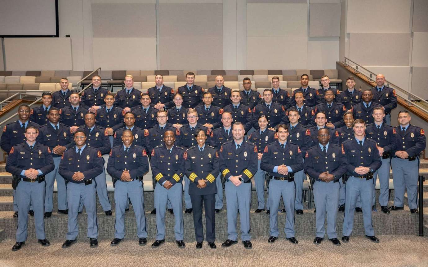 Chief Patterson poses with graduates