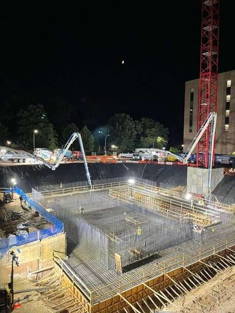 Image shows the new City Hall foundation being placed