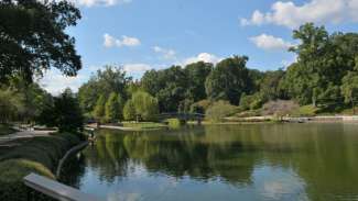 View of man made pond and bridge at Pullen Park