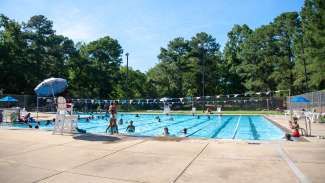 People enjoying the Biltmore Hills pool in the summertime