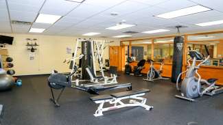 Various exercise machines and equipment in the Carolina Pines Park weight room